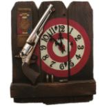 A WESTCLOX MARKSMANSHIP AWARD CLOCK, depicting a Colt Army revolver in front of a target, battery