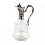 A jug for wine, glass with silver.