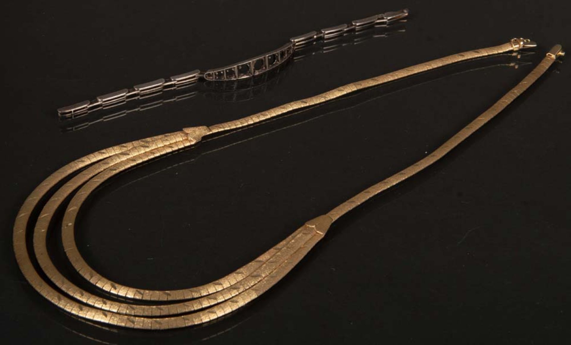 Collier und Armband. 14 ct Gold, ca. 49 g.