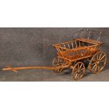 Leiterwagen mit Kindersitz. Schweiz 19. Jh. Massives Holzgestell, H=70 cm, L=200 cm, T=62 cm. >>>