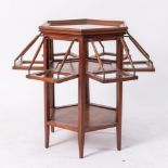 Tavolino da tÃ© vetrato con apertura a compasso di forma esagonale, realizzato in massello di
