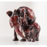 BATIGNANI CERAMICHE D'ARTE Scultura in maiolica invetriata rossa, raffigurante due elefanti. Anni '3
