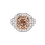 Two colour gold ring, Art Deco manner, centrally decorated deep brown diamond surrounded by light pi