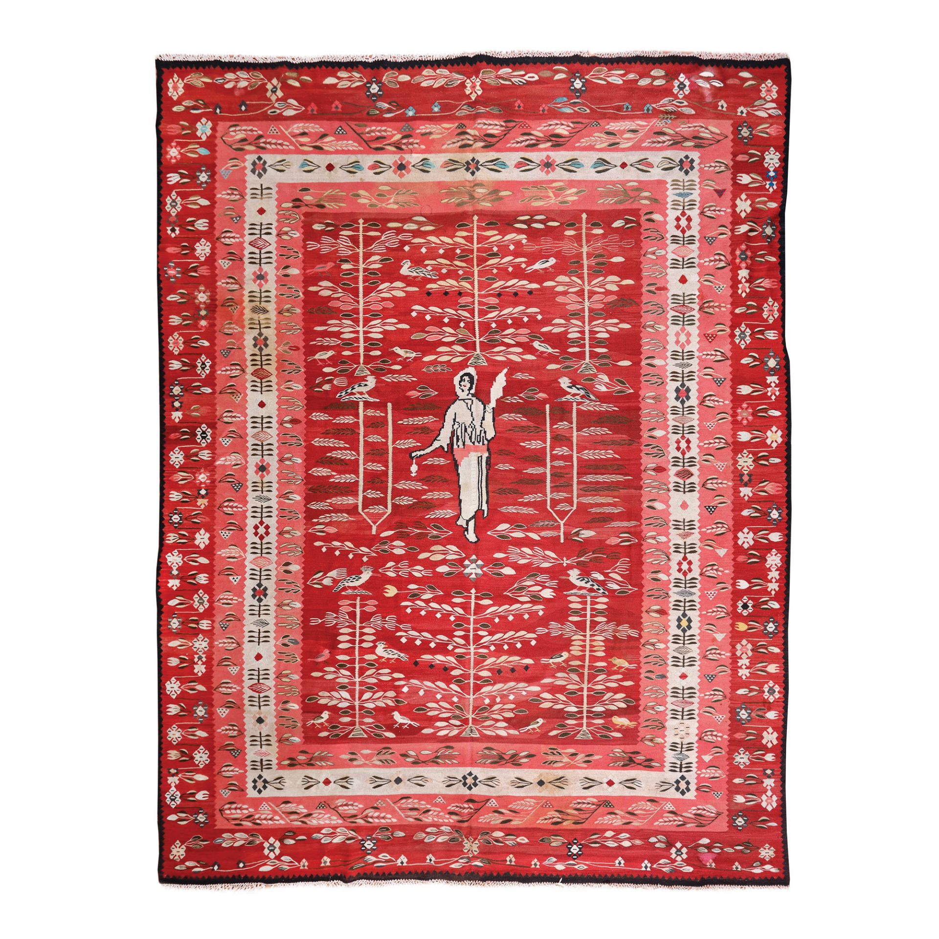 Oltenian wool rug, decorated with peasant girl with distaff and rich floral motifs, early 20th centu