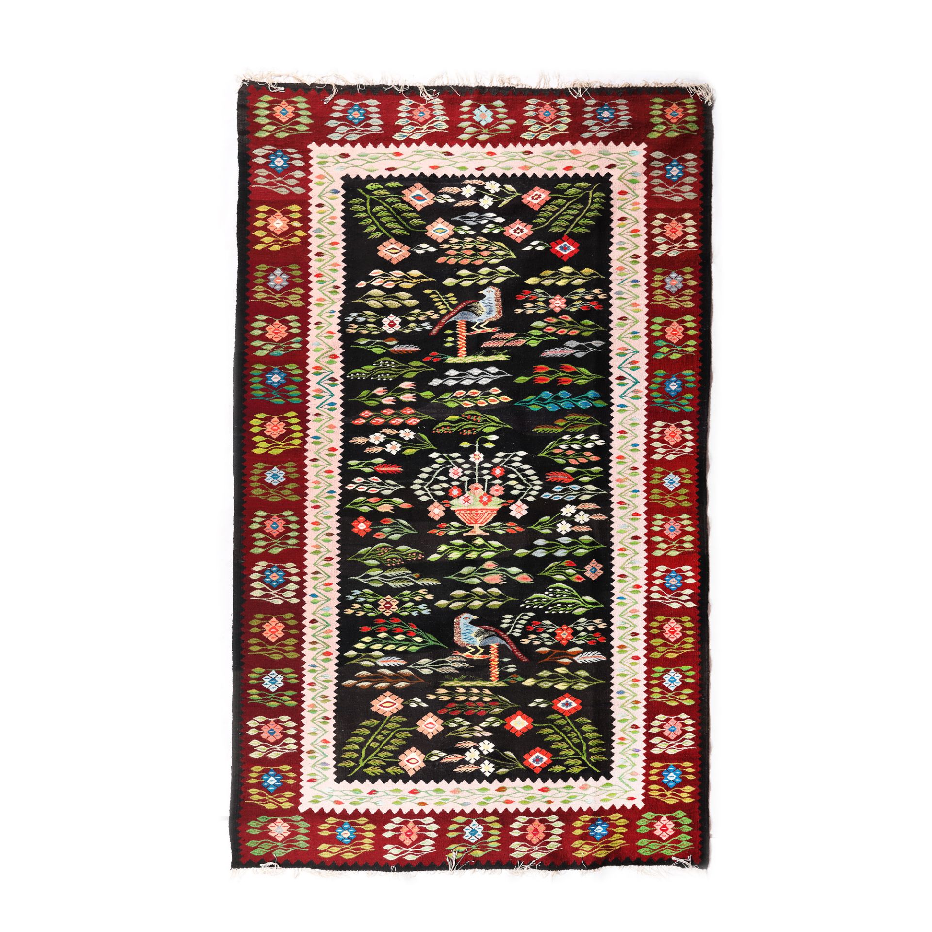 Oltenian wool rug, decorated with peacocks, hollyhocks and other specific floral motifs, first half 