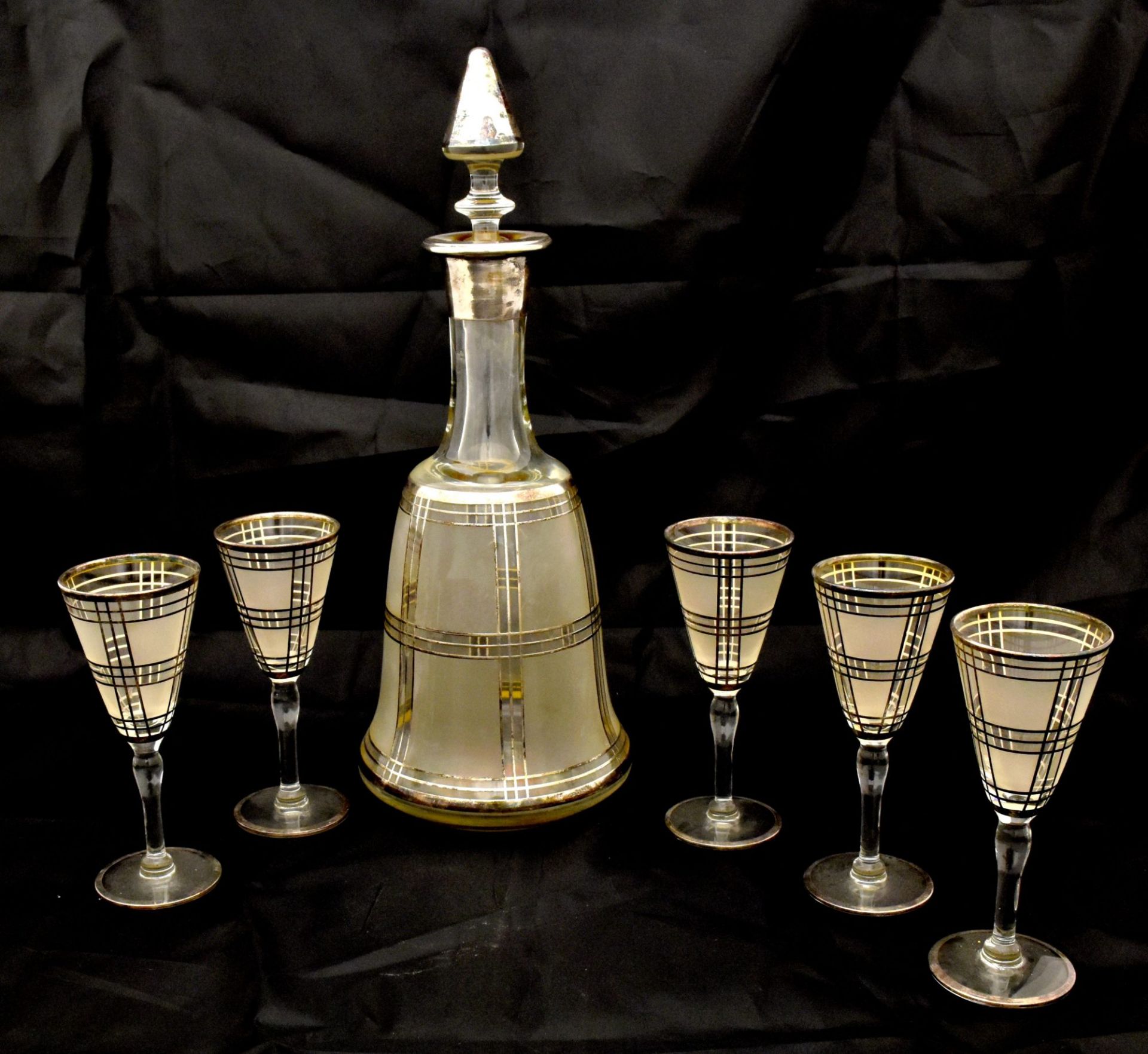 Decanter with five glasses. Europe. 20th century.