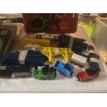 A QUANTITY OF TRAIN RELATED TOYS TO INCLUDE, PLASTIC TRACK, TOMY AND THOMAS THE TANK ENGINE