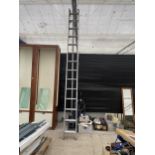 A TWO SECTION EXTENDABLE ALUMINIUM LADDER (14 RUNGS PER SECTION)