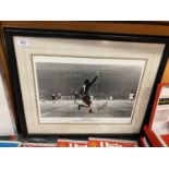 A FRAMED PRINT DEPICTING GEORGE BEST IN THE EUROPEAN CUP FINAL AT WEMBLEY IN 1968 V BENFICA