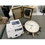 A SONY CYBER SHOT CAMERA A CLOCK AND A PICTURE FRAME