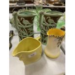 TW0 BURLEIGHWARE YELLOW JUGS (ONE A/F) AND TWO BURLEIGHWARE GREEN AND BROWN JUGS EMBOSSED WITH