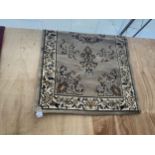 A BROWN FLORAL RUG APPROX 62 INCH X 32 INCH