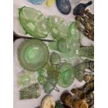 A COLLECTION OF GREEN GLASS WARE TO INCLUDE HANDLED DISHES, ART DECO STYLE FRUIT BOWLS, CAKE