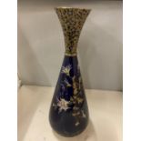 A LARGE BULBUS GILT AND ROYAL BLUE HIGHLY DECORATIVE VASE WITH HAND PAINTED FLORAL DETAILING, MARKED