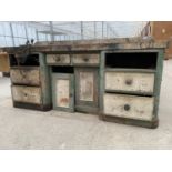 A LARGE VINTAGE WORK BENCH ENCLOSING SIX DRAWERS AND A LOWER CUPBOARD TO ALSO INCLUDE A RECORD BENCH