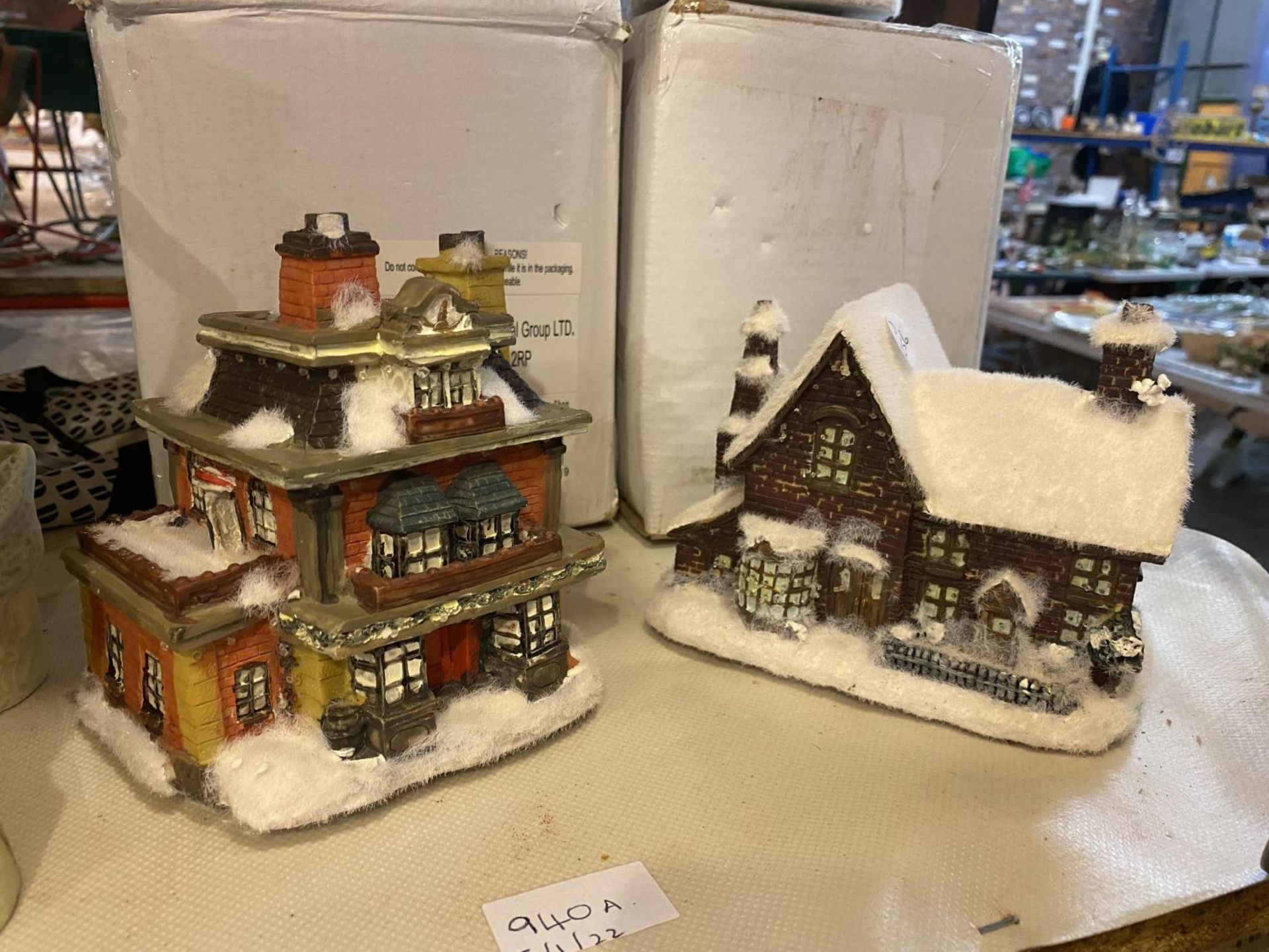 FOUR ILLUMINATED CHRISTMAS HOUSES TO INCLUDE A CHURCH, PUB, TOY SHOP. NOT WORKING AT TIME OF LOTTING - Image 2 of 2