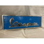 A BLUE AND CHROME VESPA CAST SIGN