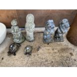 A COLLECTION OF RECONSTITUTED STONE GARDEN ORNAMENTS TO INCLUDE TWO GNOMES AND A PAIR OF LIONS