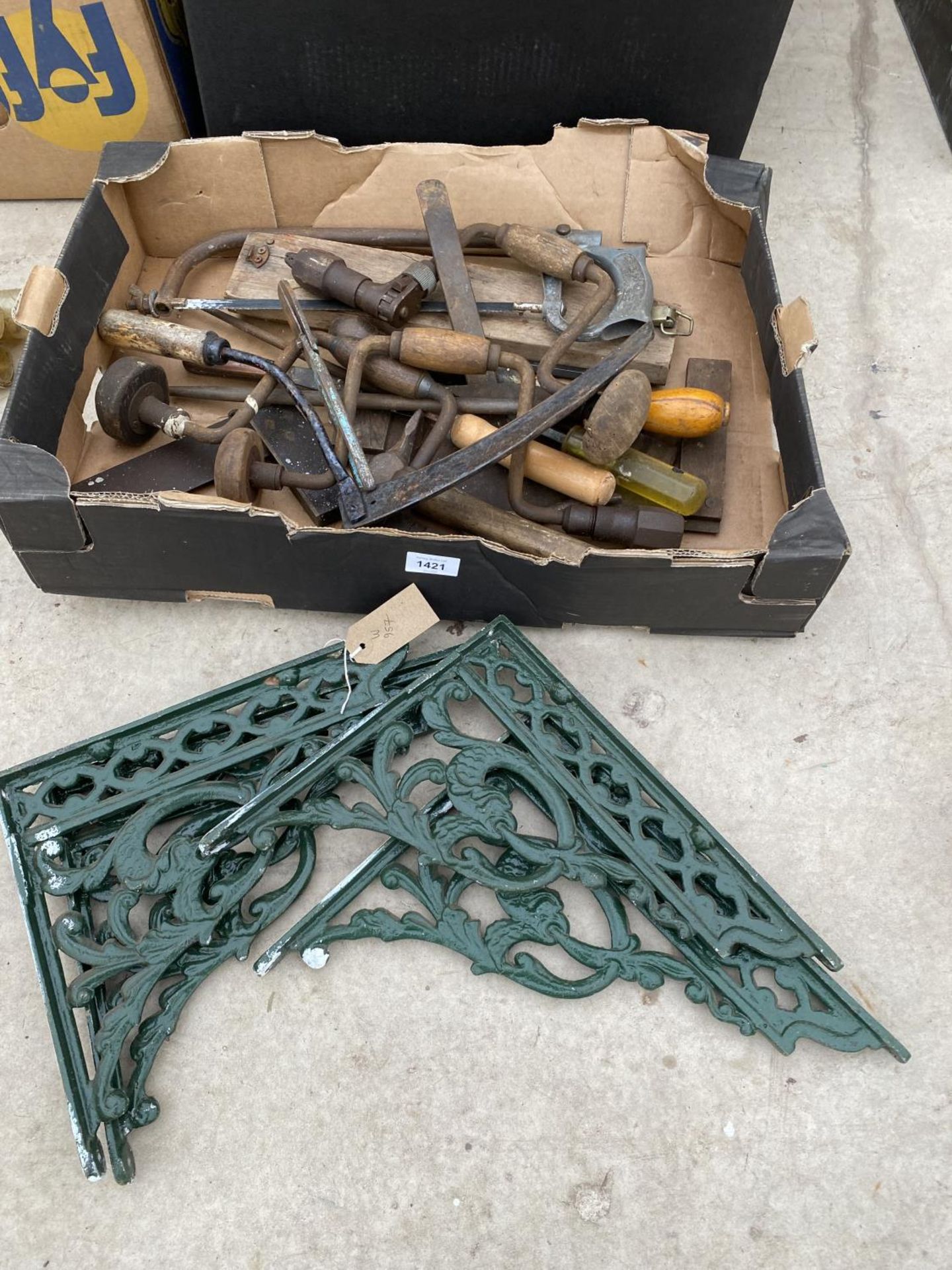 TWO PAIRS OF DECORATIVE CAST WALL BRACKETS AND AN ASSORTMENT OF VINTAGE HAND TOOLS