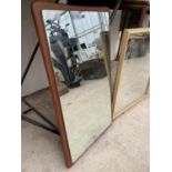 A GILT FRAMED WALL MIRROR AND A FURTHER WOODEN MOUNTED MIRROR