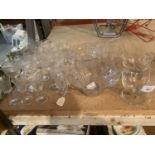A QUANTITY OF CLEAR GLASS TO INCLUDE APERITIF GLASSES, SHERRY, TUMBLERS, BOWLS, ETC