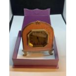 A PINK ENAMALLED TRAVEL CLOCK IN A PRESENTATION BOX