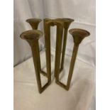 A BRASS GOTHIC STYLE FOUR BRANCH CANDLESTICK