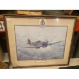 A FRAMED PICTURE OF A SPITFIRE ENTITLED 'MISSION ACCOMPLISHED' BY JOHN H EVANS