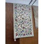 A WOOLEN FLORAL RUNNER APPROX 76 INCH X 27 INCH