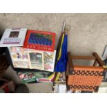 AN ASSORTMENT OF BOOKS, UMBRELLAS AND A STOOL