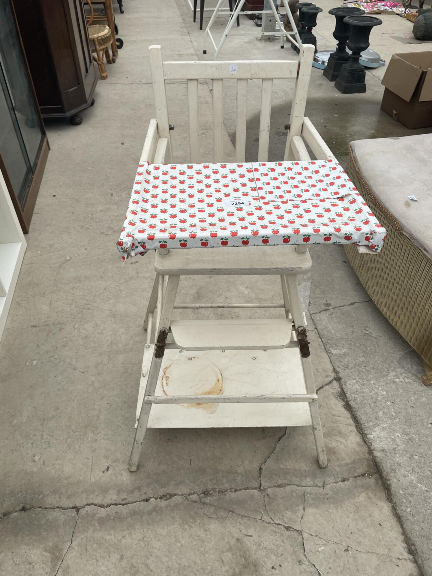 A WHITE PAINTED METAMORPHIC CHILDS HIGH CHAIR