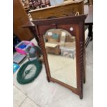 A WOODEN FRAMED BEVELED EDGE MIRROR AND A FURTHER FRAMED MIRROR