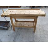 A MODERN WORK BENCH WITH WOODEN VICE