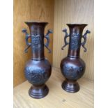 A PAIR OF DECORATIVE BRONZE BUD VASES