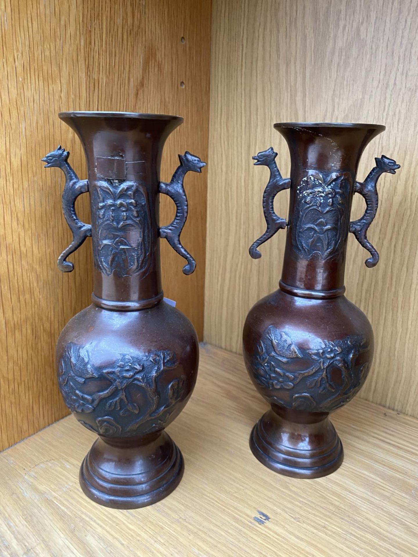 A PAIR OF DECORATIVE BRONZE BUD VASES