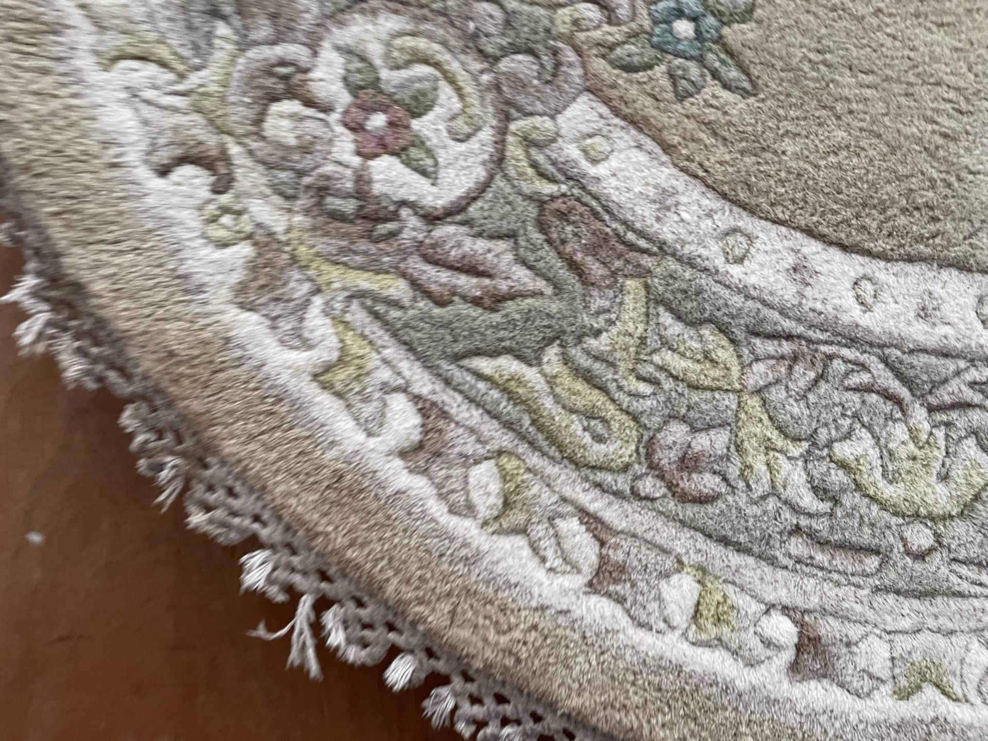 AN OVAL CREAM PATTERNED RUG - Image 2 of 2