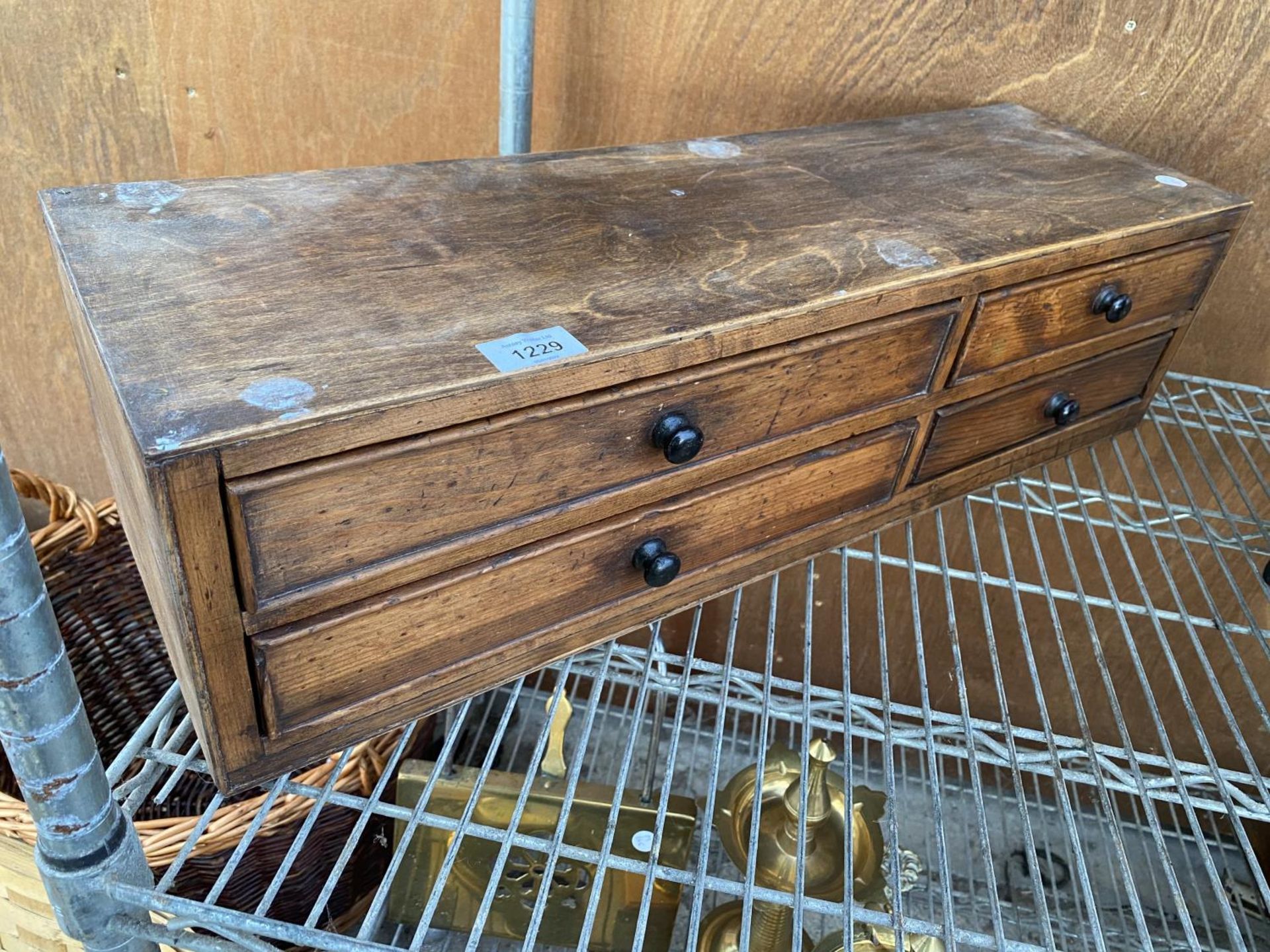 A VINTAGE WOODEN CHEST ENCLOSING FOUR DRAWERS