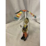 A TIN PLATE TOY CLOWN