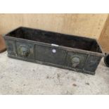 A VINTAGE HEAVY CAST IRON WINDOW BOX PLANTER WITH LION HEAD DECORATION