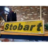 AN ILLUMINATED STOBART SIGN