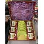 A BOXED PALISSY LIMEGROVE CUP AND SAUCER SET