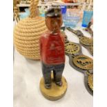A VINTAGE WOODEN CARVING OF A OLD SAILOR MOUNTED ON A HEAVY BASE