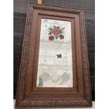 A WOODEN FRAMED MIRROR WITH FLORAL DECORATION