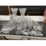 AN ASSORTMENT OF GLASS WARE TO INCLUDE TWO LARGE CUT GLASS VASES, DECANTORS AND A TRAY ETC