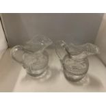 A NEAR PAIR OF REGENCY GLASS WATER JUGS HEIGHT 18CM