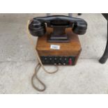 A VINTAGE BAKELITE DICTOGRAPH TELEPHONE SYSTEM WITH AN OAK CASED BOTTOM BELIEVED TO BE A BANK SWITCH