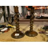 A PAIR OF MAHOGANY BARLEY TWIST CANDLESTICKS