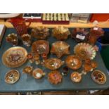 A LARGE AMOUNT OF AMBER CARNIVAL GLASSWARE TO INCLUDE JUGS, PLATES, GLASSES, BOWLS, ETC