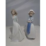 TWO NAO FIGURINES OF ALADY AND A LADY WITH A DOG
