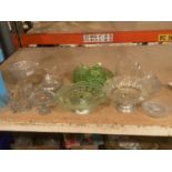 A QUANTITY OF GLASSWARE TO INCLUDE A GREEN GLASS DRESSING TABLE SET, CAKE STANDS, LIDDED DISHES, ETC